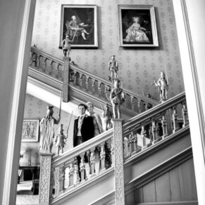 The Jacobean staircase provides a striking backdrop for this photo opportunity with the newlyweds at Hartwell House 