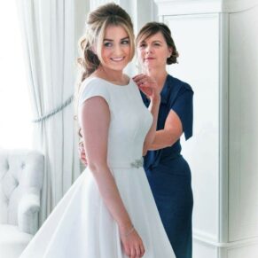Mum helps her daughter with the final preparations before the civil ceremony at her Hedsor House wedding 