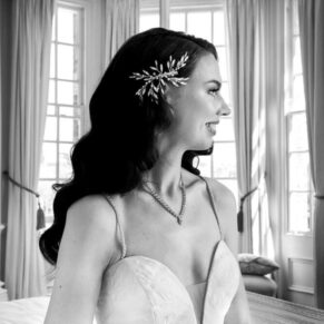 Dramatic black and white pose of the bride captured before the ceremony on her Hedsor House wedding day