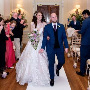 The happy newlyweds exit the civil ceremony at their Hedsor House wedding 