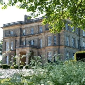 Hedsor House captured through the stunning floral landscape on a summer's wedding day   