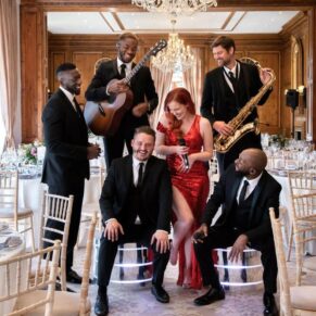 The function band all set and ready to perform for the guests during the meal at this fabulous Hedsor House wedding reception 