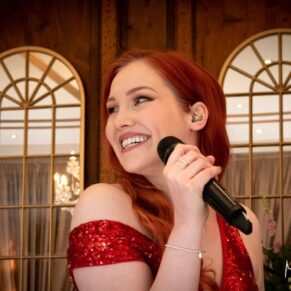 The lead singer with the Function Band gets ready to sing at this Hedsor House wedding