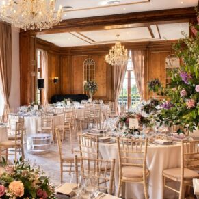 The grand dining room interior all setup at Hedsor House for the wedding breakfast 