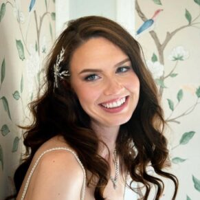The bride poses for my camera with gorgeous window lighting at this Hedsor House wedding 