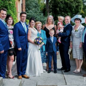 Wedding group pose on the upper terrace of the Latimer Estate 