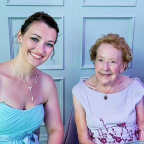 The smiling bridesmaid with her grandma captured just before the speeches started in the dining room