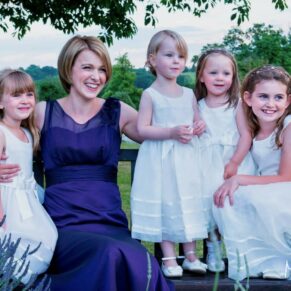 Proud mum poses with her flower girl daughters at this Latimer Estate summer wedding 