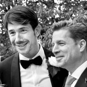 The groom with one of his usher's enjoying a giggle during the drinks reception on the hotel's terrace