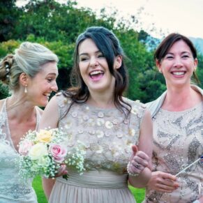 The bride and her bridesmaids captured larking around during the drinks reception  