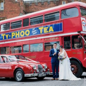 Photography of the newlyweds with their fleet of red vehicles by the main house on their Latimer Estate wedding day  