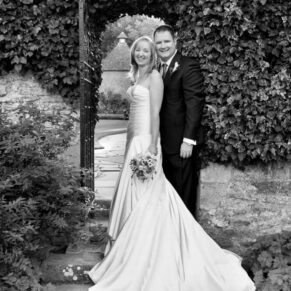 The newlyweds captured in the gardens for this black and white pose at their Le Manoir Aux Quat Saisons wedding 