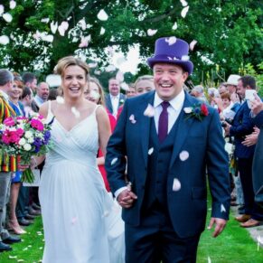Micklefield Hall Wedding Photography - great fun confetti aisle with the newlyweds centre stage