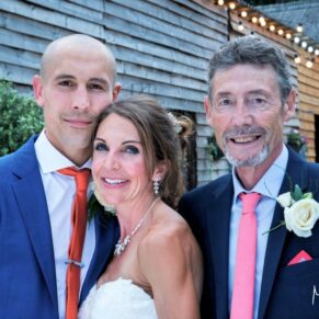 Monkton Barn Wedding Photography - the newlyweds pose with a relative for the camera