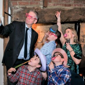 Notley Tythe Barn Wedding Photography - fun selfie moment for this family in the barn
