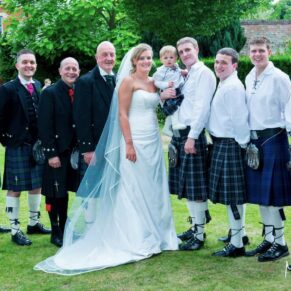 Odney Club Wedding Photography - the bridal party pose for the camera