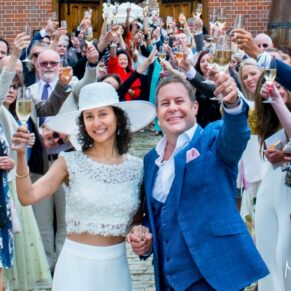 The newlyweds charge their glasses along with all of their guests during this informal wedding reception at The Dairy on the Waddesdon Estate