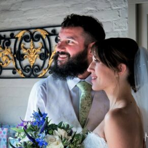 Five Arrows Hotel - Buckinghamshire Wedding Photographer - the newlyweds looking away from the camera inside the venue