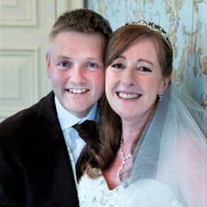 The newlyweds pose for my camera in the Oak Room at their Pendley Manor Hotel wedding 