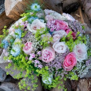 Stunning bouquet captured against a rustic wood backdrop at Pendley Manor Hotel wedding 