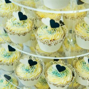 Yummy looking wedding cupcakes on a cake tier at Pendley Manor Hotel