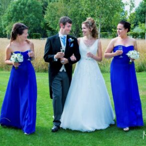 Runnymede Hotel Wedding Photography - the couple with their bridesmaids take a stroll