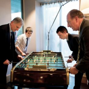 Runnymede Hotel Wedding Photography - table football being enjoyed by the guests