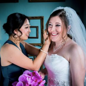 Stoke Place wedding photography - final adjustments for the bride before the ceremony 