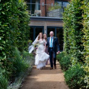 Swan at Streatley wedding photography - the bride on route to the ceremony with her dad