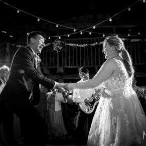The action packed first dance of the bride and groom at their Tudor Barn evening reception