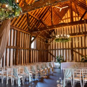 Civil wedding ceremony setup inside the historic barn at The Olde Bell in Hurley