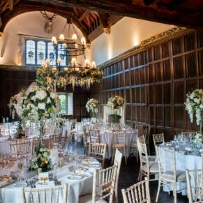 The Great Hall setup for the day with a white themed floral displays