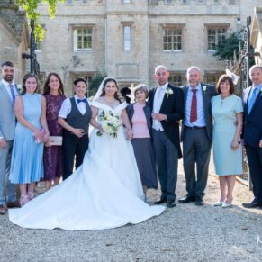 Beautifully backlit family group pose in the main gateway at the front of Weston Manor Hotel