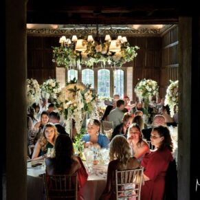 Atmospheric shot through a doorway during the meal in the Great Hall at the wonderful Weston Manor Hotel