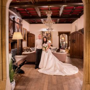 The newlyweds inside the entrance area of this grand historic venue