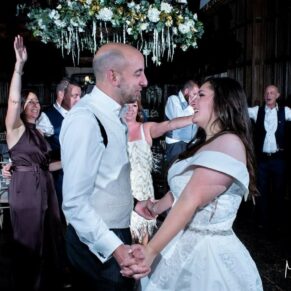 The newlyweds captured in the atmospheric Great Hall during their first dance