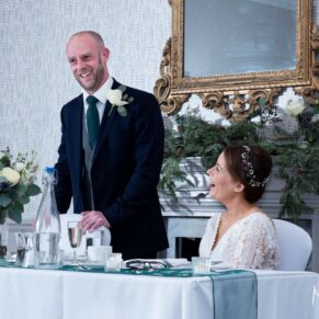 Photography of the groom's speech in full flow captured during the meal at his Castle Hotel wedding in Windsor 