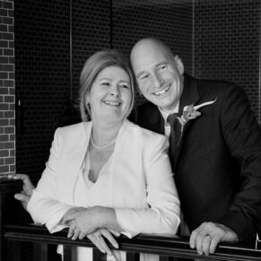 The newlyweds smiling for the camera at their Hotel Du Vin Henley wedding
