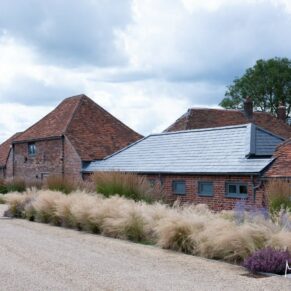 The car park at Rackleys Barn wedding venue is spectacularly landscaped with a prairy style planting scheme