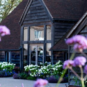 The front of Rackleys wedding barn is beautifully landscaped with fabulous flower borders