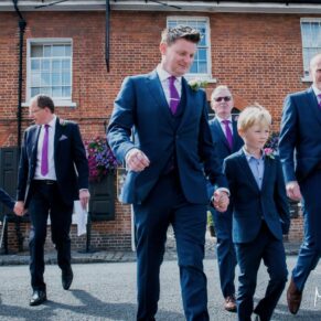 The groom and the lads crossing the road in Amersham High Street prior to his Kings Chapel wedding reception 