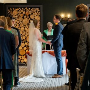The exchange of the rings captured during the indoor civil ceremony at The Manor House Hotel in Moreton-in-Marsh