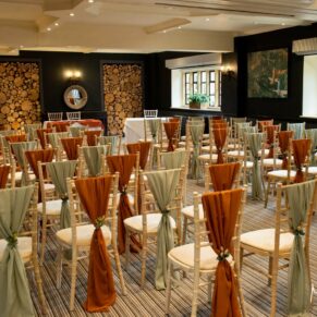 The colourful wedding civil ceremony room setup prior the the main event at The Manor House Hotel in Moreton-in-Marsh