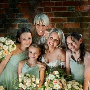 The bride with her bridesmaids captured with some dramatic lighting at her Kings Chapel Old Amersham wedding