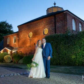The newlyweds at dusk outside the Kings Chapel in Old Amersham on their wedding day