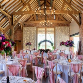 Interiors photography of the historic barn at this wonderful Buckinghamshire wedding venue prior to the meal