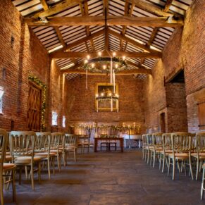 Interiors photography of the vast historic barn interior at this wonderful Buckinghamshire wedding venue 