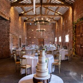 Photography of cake and stunning barn wedding venue interior at this wonderful Buckinghamshire venue 