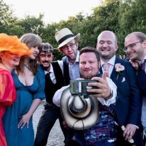 Selfie photography time for some wedding guests with the groom enjoying the party vibe at this fabulous Buckinghamshire barn location  