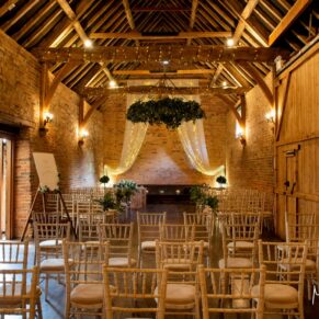 Interior wedding photography of this Buckinghamshire barn venue just prior to the wedding ceremony